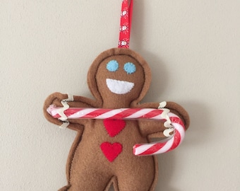 Items similar to Embroidered Felt Gingerbread Man Candy Cane Holder ...