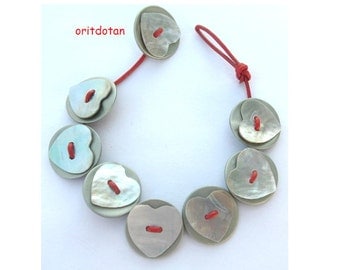Bracelet button jewelry made of heart shell buttons and vintage buttons on leather cord