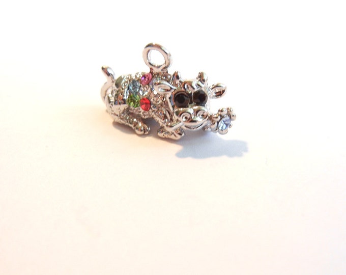 Small Silver-tone Rhinestone Accented Laying Bull with Flower Charm