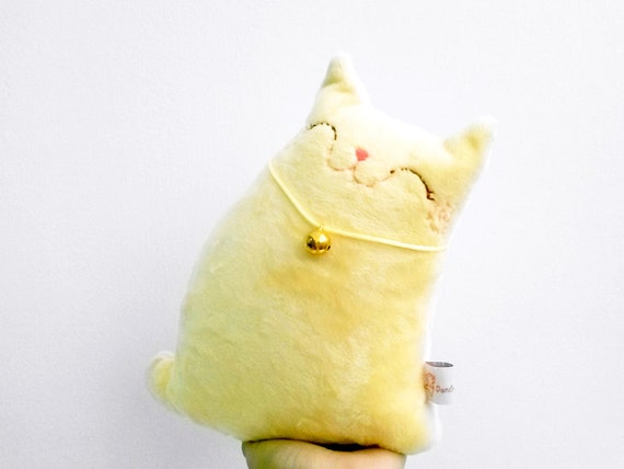 yellow stuffed cat