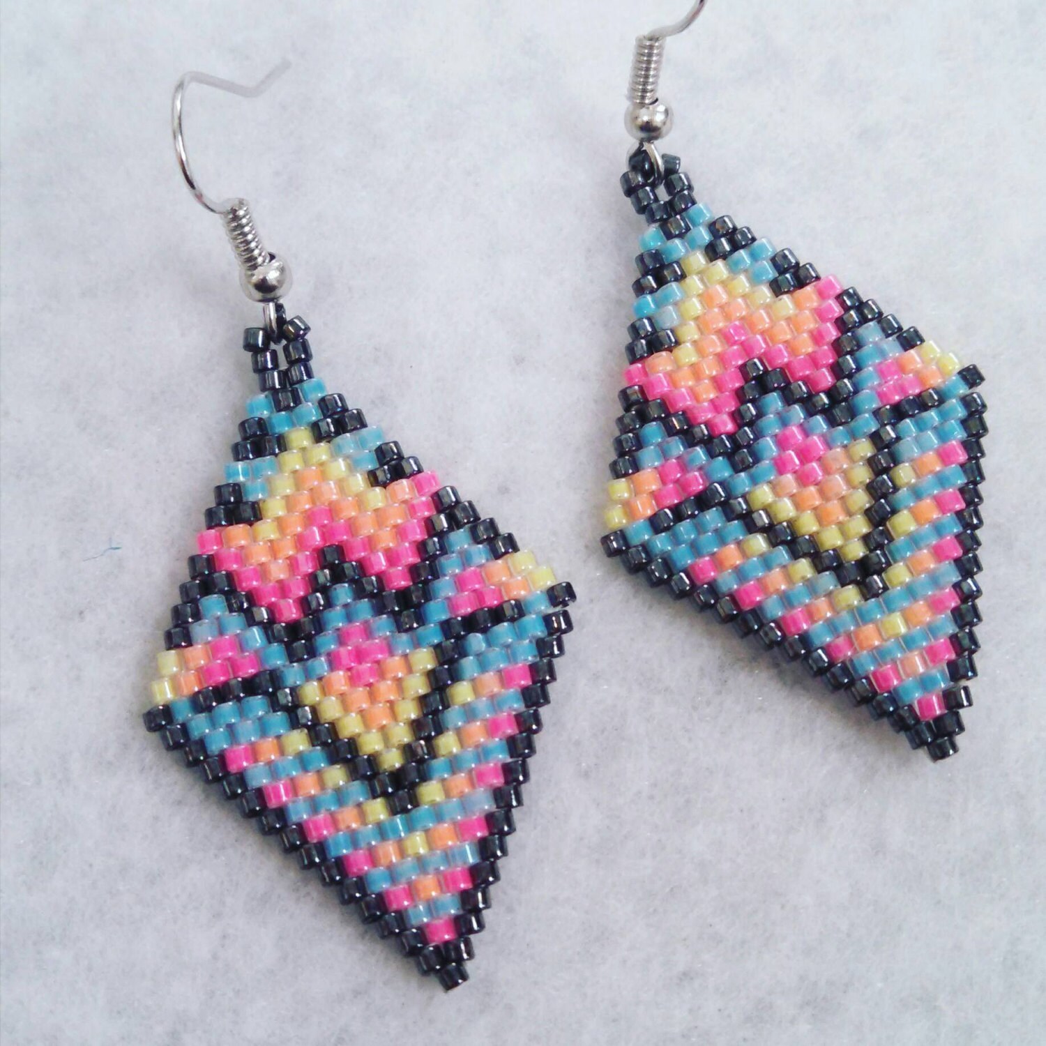 Neon tribal style hand beaded earrings by