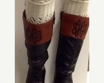 monogram plaque long leather boots
