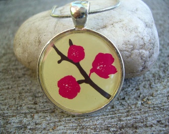 Graphic print cherry blossoms round resin pendant with chain