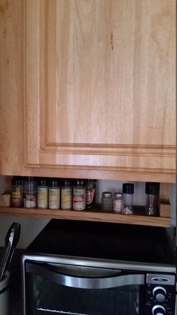 Repurposed wood under spice shelf