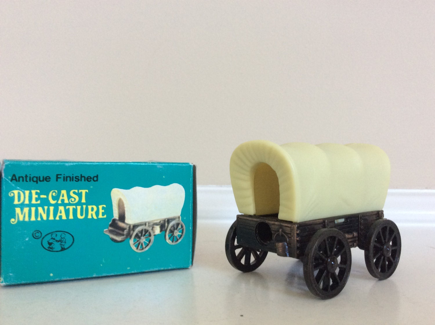 A Die Cast Miniature Antique Finished Coverd Wagon Figure