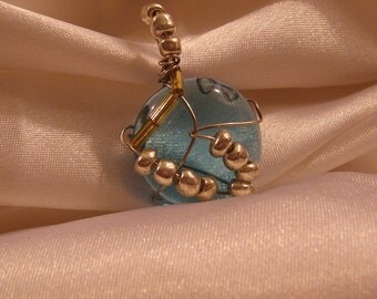 Ocean blue mocaic glass pendent with glass & metallic beads.