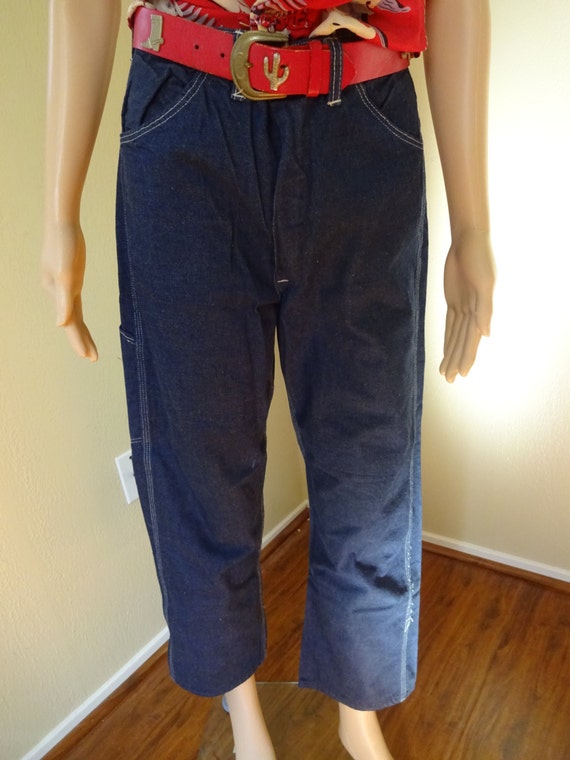 dark blue jeans with white stitching