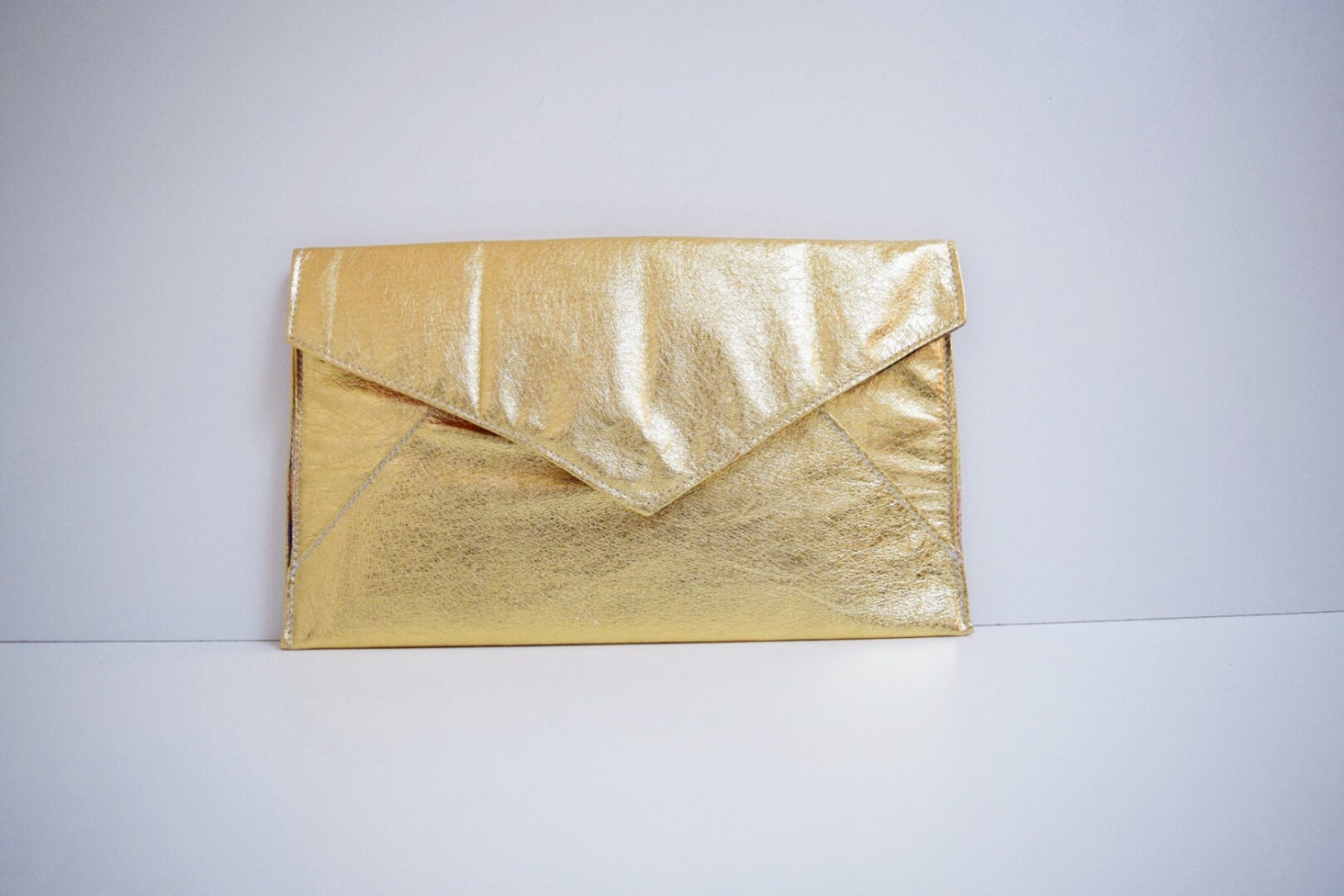 gold oversized clutch bag