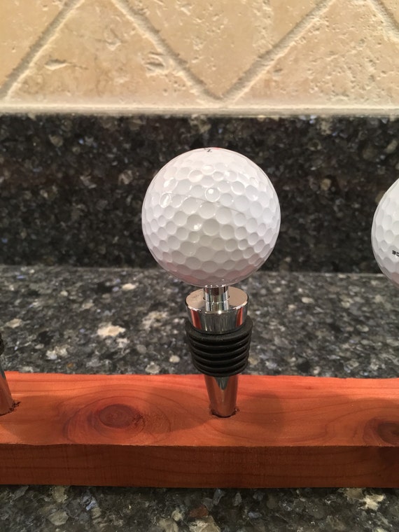 Golf ball wine stopper. A hole in one gift Golfer gift gift