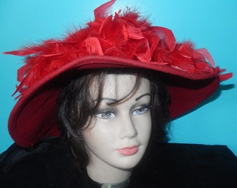beautiful red Betmar hat with feathers all around