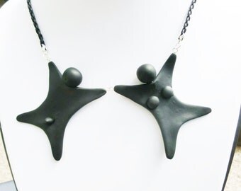 Male female puppets necklace/ naughty naked dolls pendant/ black Fimo dolls holding hands/ 2 hanging points/ different base chain possible/