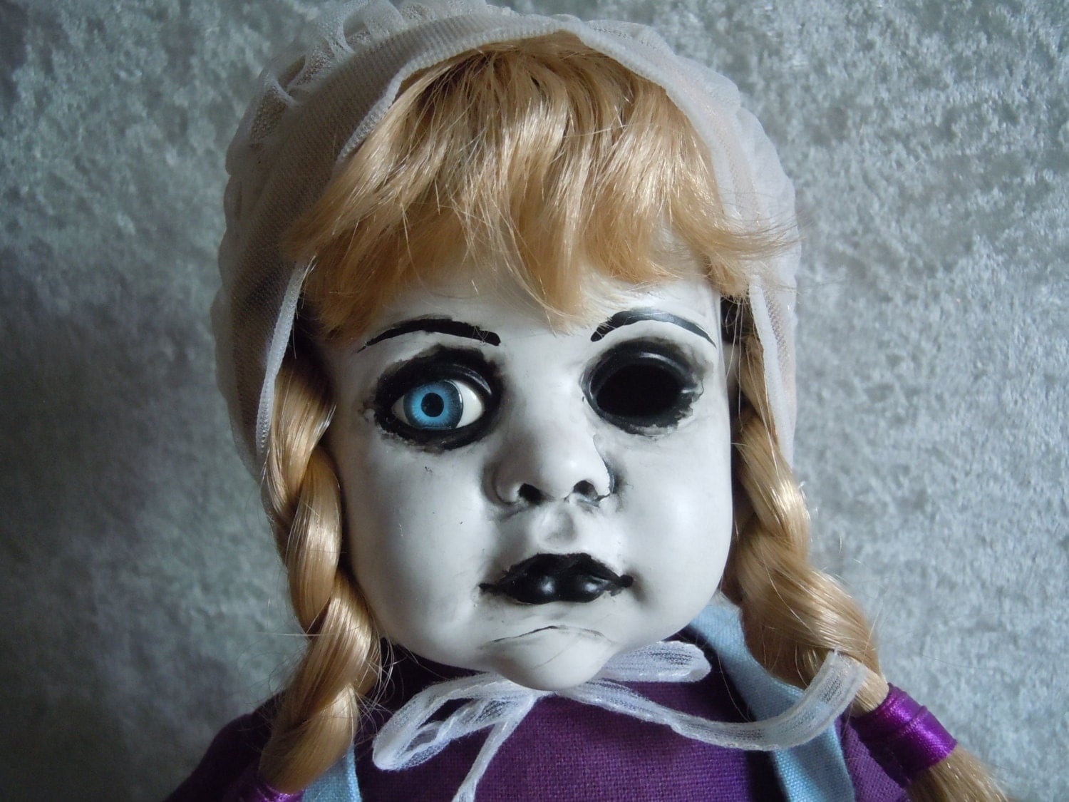 Creepy Doll blonde hair in braids and one eye