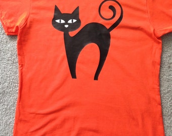 Halloween shirt, glow-in-the-dark tee, black cat shirt, orange t shirt, adult youth sizes, halloween cat, glowing eyes shirt, halloween gift