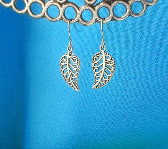 Decorative silver leaf dangle earrings.