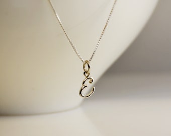 Tiny initial necklace. Sterling silver cursive letter charm.
