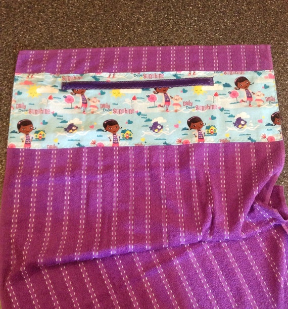 Beach towel with zippered pocket