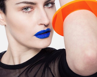 Lucite neon orange bracelet, minimal perspex bangle.