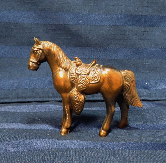 old metal horse figurines