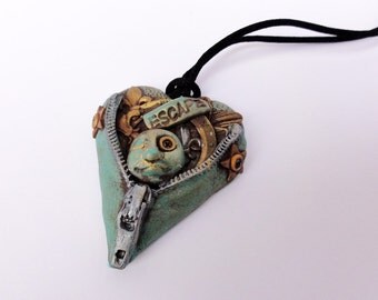 Unzipped Heart Escaping is a heart with a zipper and a face by Marie Segal