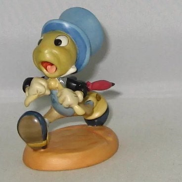 antique jiminy cricket figurine