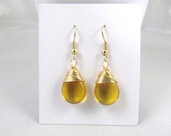 Yellow earrings honey colored glass smooth teardrops wire wrapped earrings in gold craft wire