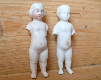 Pair of antique German glazed bisque dolls, small frozen Charlotte + frozen Charlie, excavated broken porcelain dolls, Victorian toy dolls