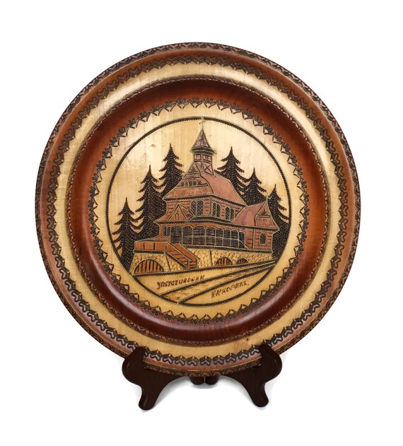 Vintage carved wooden plate intricate wood carving of home european