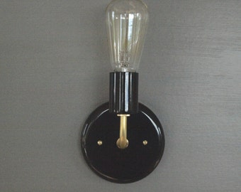Gloss black wall sconce and brass modern lighting