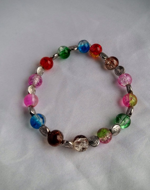 Stretchy glass bead bracelet with heart spacer beads