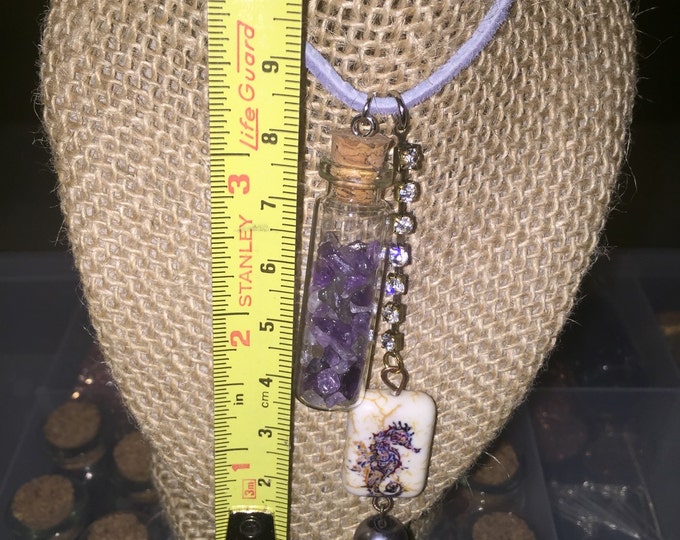 Amethyst gemstones in a mini bottle