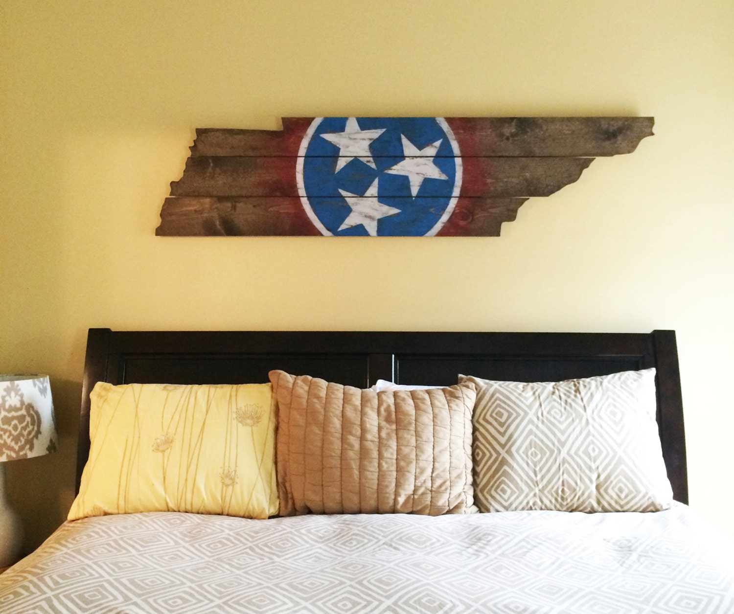 Wooden state of Tennessee cut out with state flag painted and