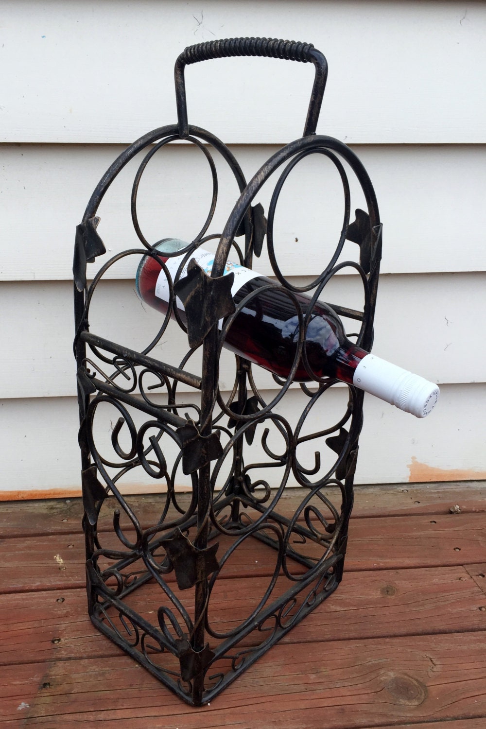 Black wrought iron wine rack contact us for delivery quote