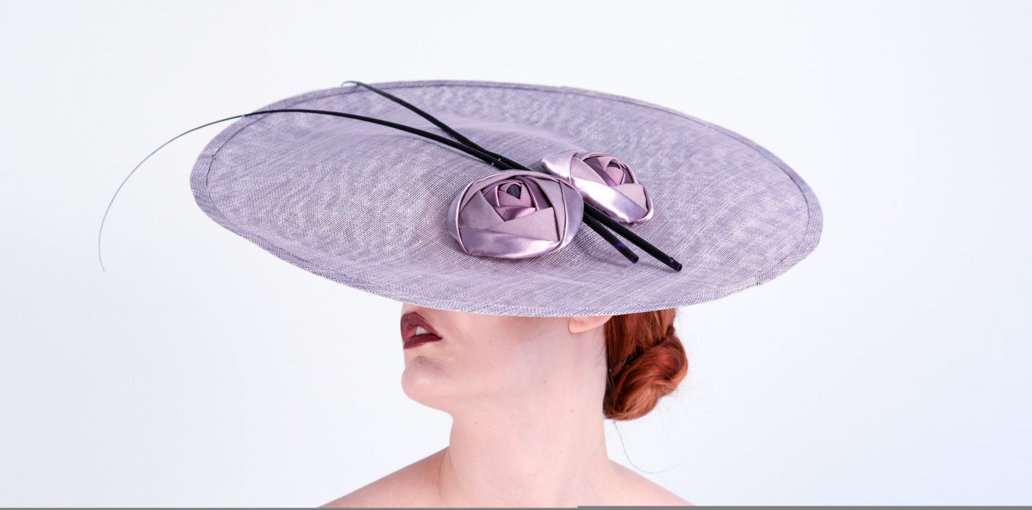 Jan. Large sinamay saucer hat with cabachon roses and spadonas