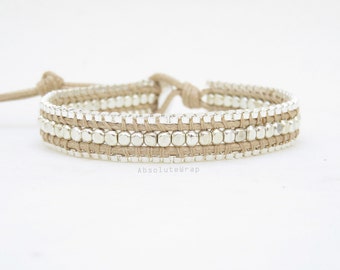 Single wrap bracelet with silver plated chain on soft beige polyester cord