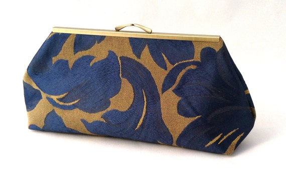 navy and gold handbag