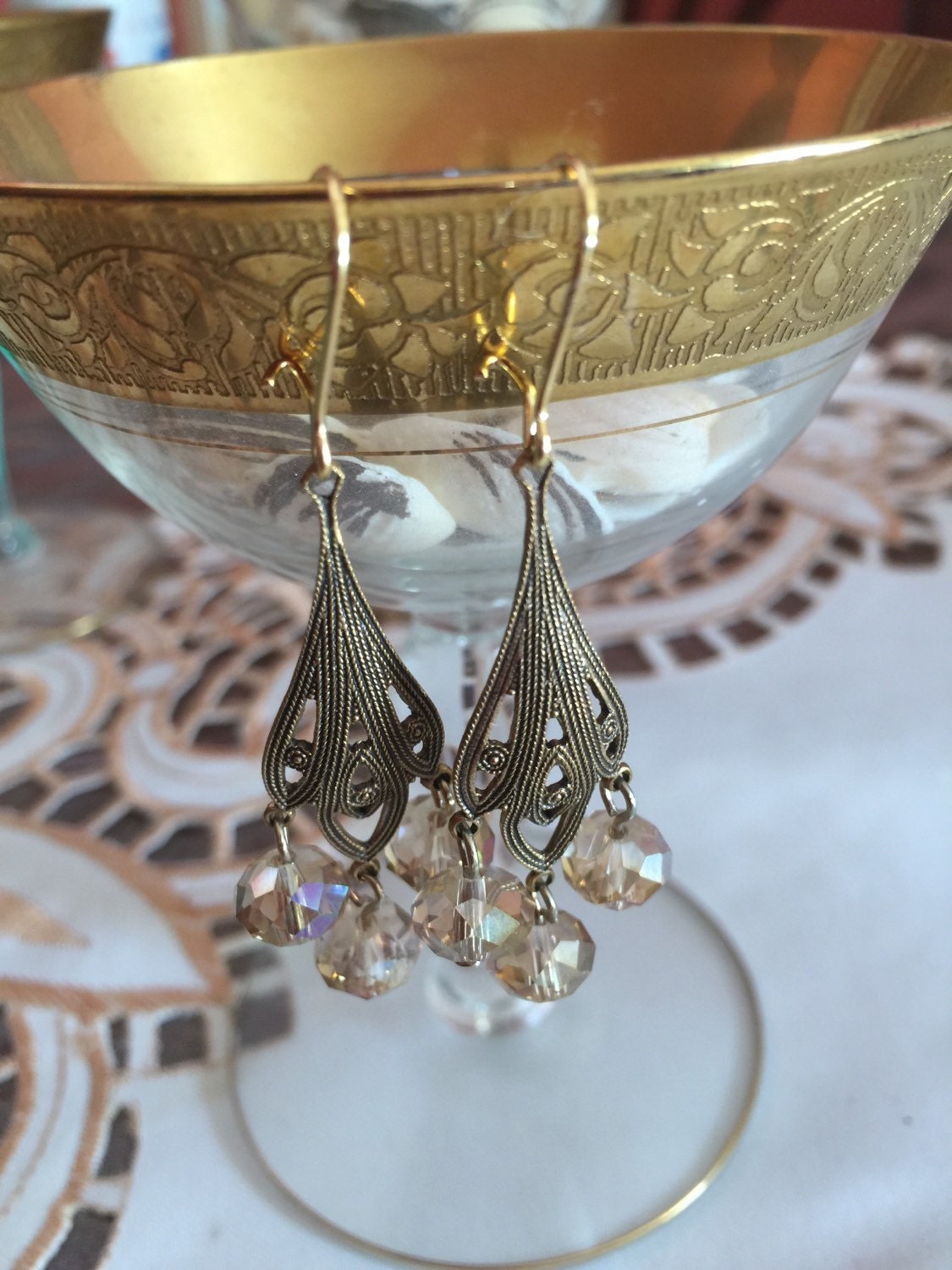 Vintage filigree dangle style earrings with three crystals and