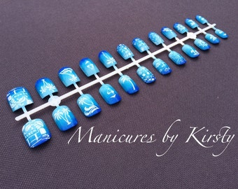 Summer holiday nautical beach side seashell nail art false nails, blue ombre gradient and stamped island theme