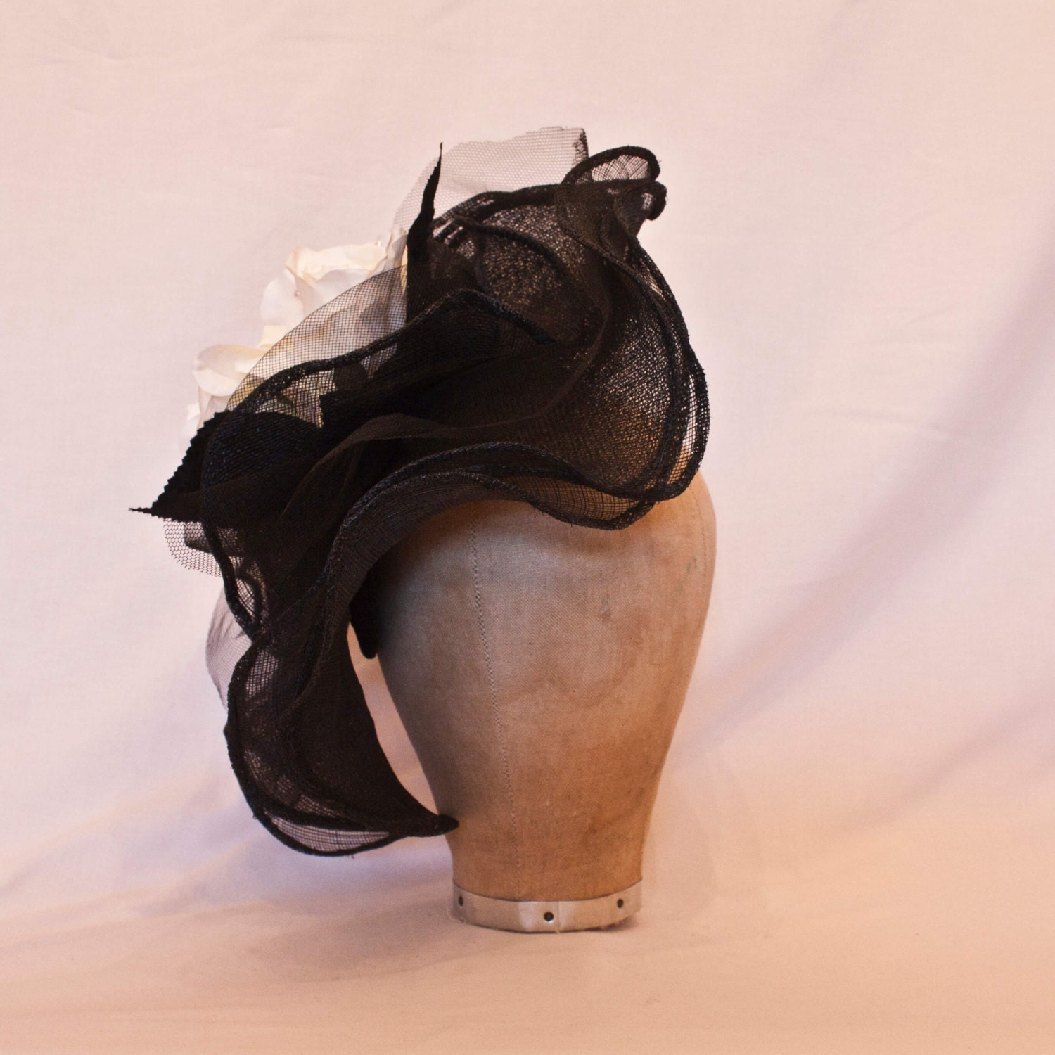 Stunning black frill side hat with white rose decoration