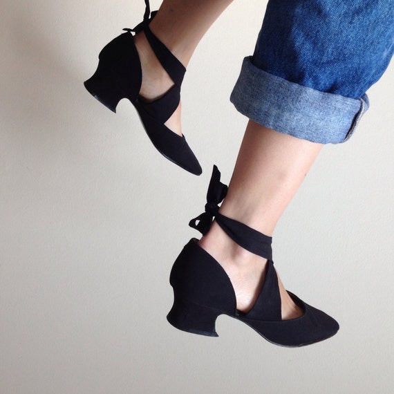 black pointed tie up heels