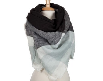 Light blue, black and white plaid blanket scarf. 100% acrylic.
