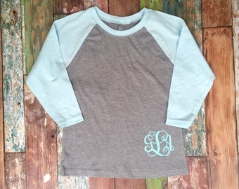 monogram on bottom of shirt