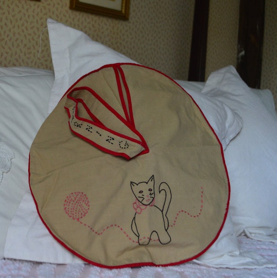 This adorable embroidered round bag you could by LillyRoseVintage