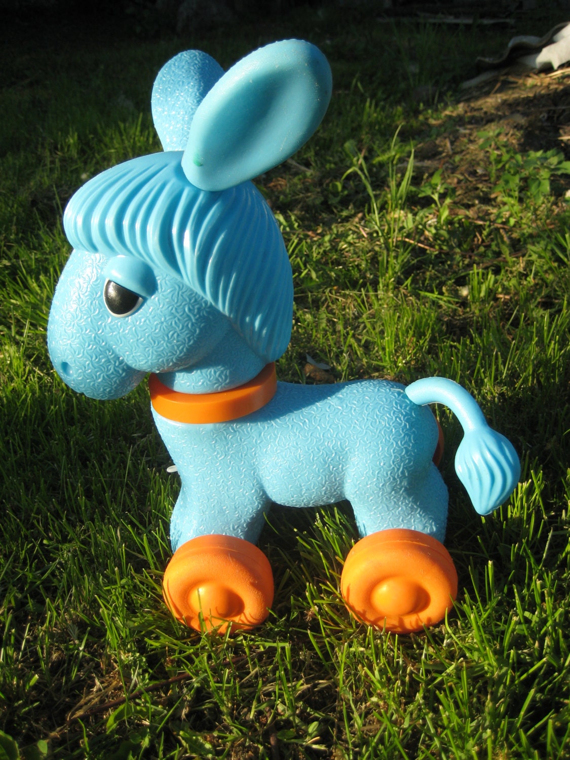 Vintage toy donkey on wheels/plastic donkey