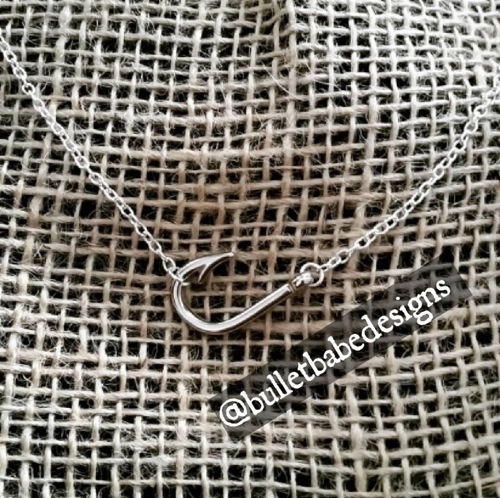 Sideways fish hook charm necklace in silver fish hook
