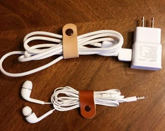 Leather ear bud holder, ear phone holder, leather cord organizer, cell phone cord holder, cell phone power cord holder, leather cord keeper