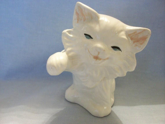 white ceramic cat figurine