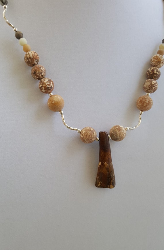 Fossilized bear tooth necklace