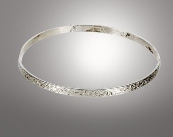 sterling silver bangle decorated with leaf designs