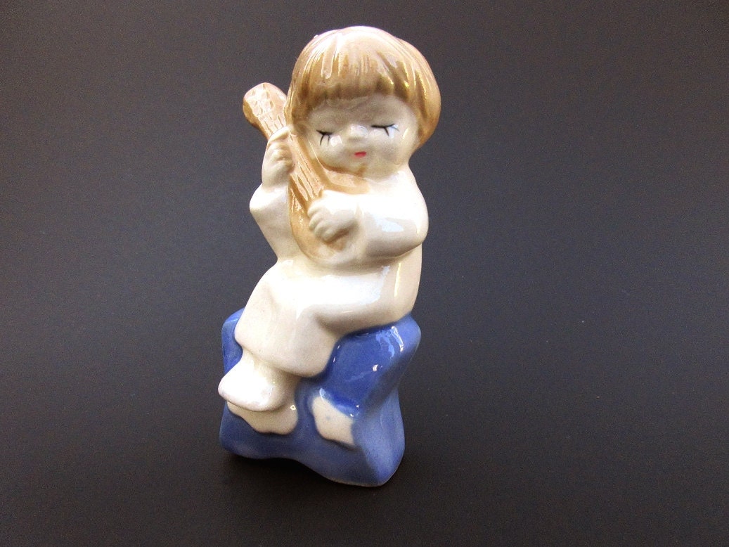 Vintage ceramic angel figurine boy with guitar by PeachNifty