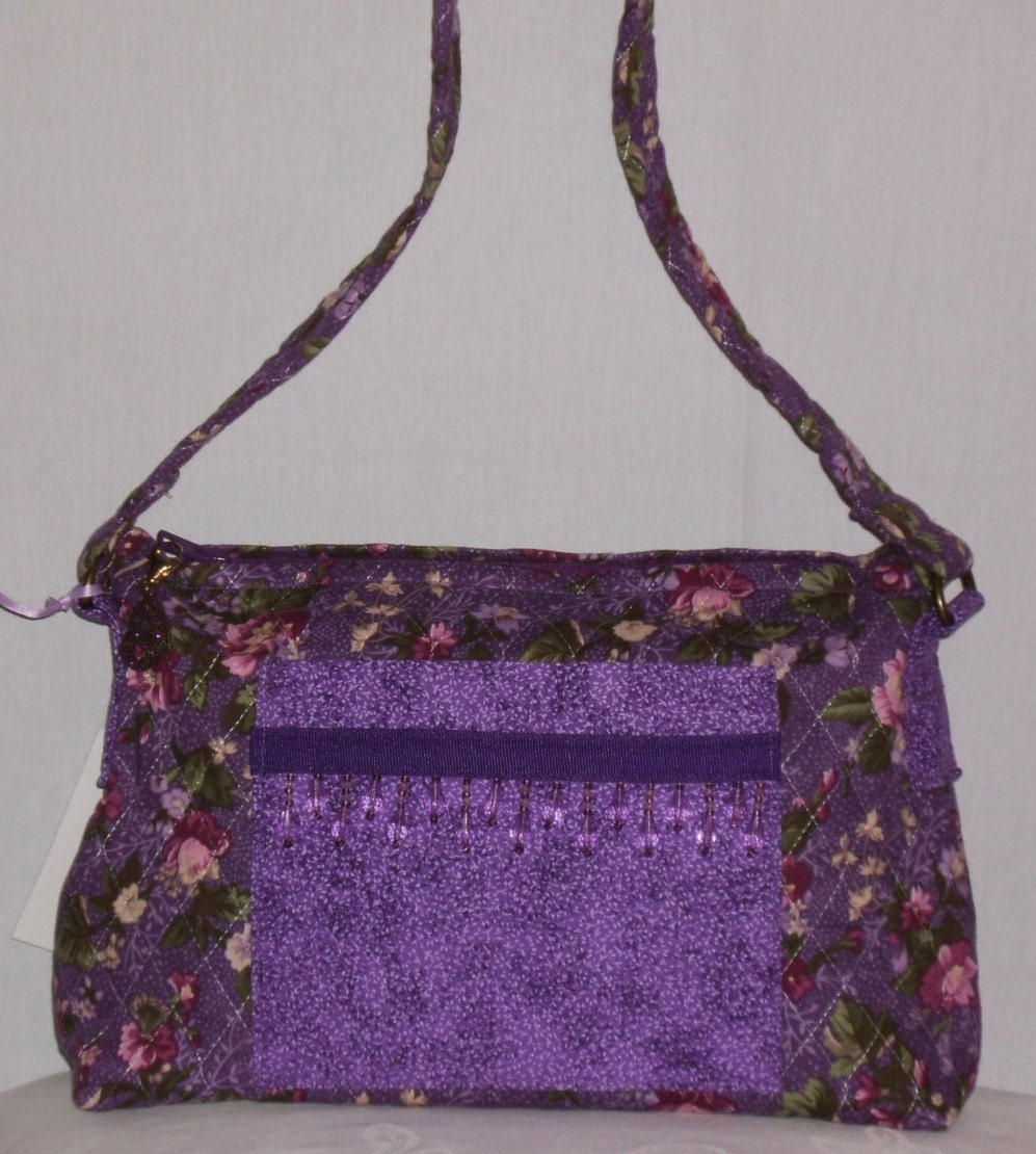 purple quilted handbag